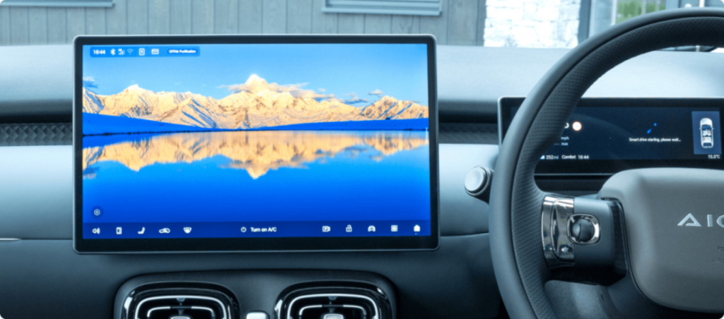 aion ut dashboard showing the central infotainment touchscreen and digital instrument display