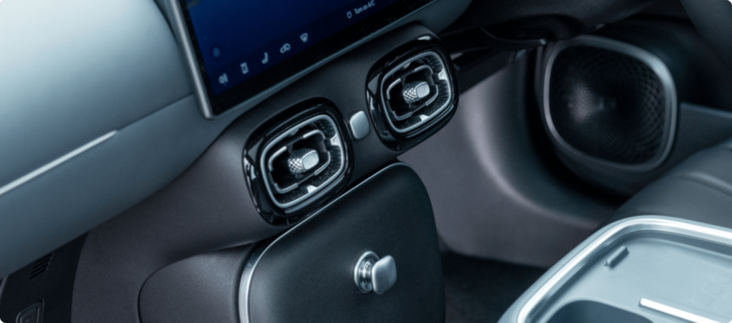 close up of the aion ut interior showing central air vents and climate control area
